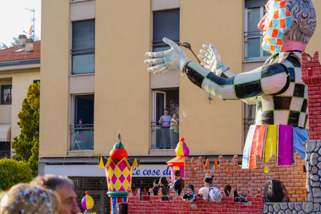 Cantu, Italy - February 25, 2023: Carnival parade, with allegorical figure wagon, in Cantu, Lombardy, Northern Italyのeditorial素材