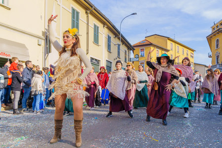 Cantu, Italy - February 25, 2023: Carnival parade, dancers group, and crowd, in Cantu, Lombardy, Northern Italyのeditorial素材