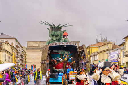 Crema, Italy - February 26, 2023: Carnival parade, with allegorical figure wagon, and crowd, in Crema, Lombardy, Northern Italyのeditorial素材