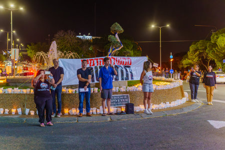 Haifa, Israel - November 04, 2023: Singing the national hymn, in an assembly of solidarity with the hostages kidnapped to Gaza and protest against the government. Haifa, Israelのeditorial素材