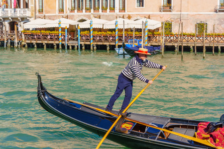 Venice, Italy - February 28, 2022: View of the grand canal with gondolas, gondoliers, and other people, in Venice, Veneto, Northern Italyのeditorial素材