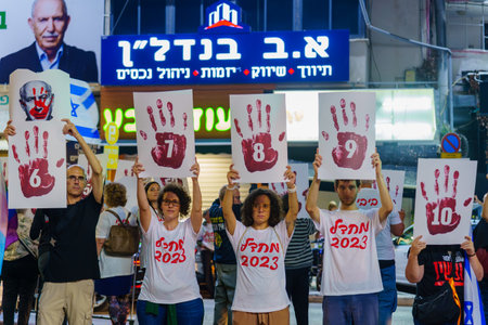 Haifa, Israel - November 11, 2023: Protest display blaming the 64 coalition members, calling for taking responsibility of the war and release of hostages. Haifa, Israelのeditorial素材