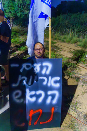 Caesarea, Israel - November 11, 2023: People protest against the prime minister Benjamin Netanyahu, calling for taking responsibility and resign. Caesarea, Israelのeditorial素材