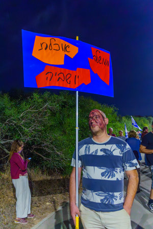 Caesarea, Israel - November 11, 2023: People protest against the prime minister Benjamin Netanyahu, calling for taking responsibility and resign. Caesarea, Israelのeditorial素材