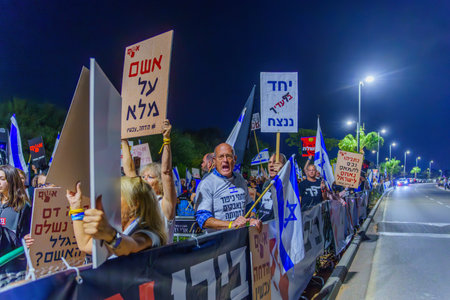 Caesarea, Israel - November 11, 2023: People protest against the prime minister Benjamin Netanyahu, calling for taking responsibility and resign. Caesarea, Israelのeditorial素材