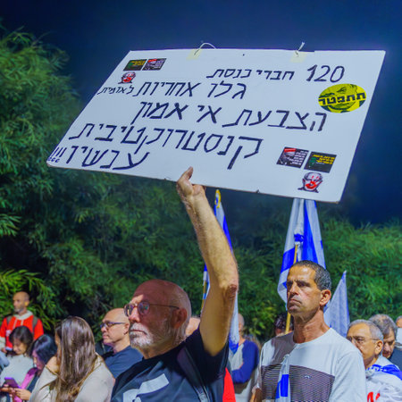 Caesarea, Israel - November 11, 2023: People protest against the prime minister Benjamin Netanyahu, calling for taking responsibility and resign. Caesarea, Israelのeditorial素材