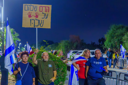 Caesarea, Israel - November 11, 2023: People protest against the prime minister Benjamin Netanyahu, calling for taking responsibility and resign. Caesarea, Israelのeditorial素材