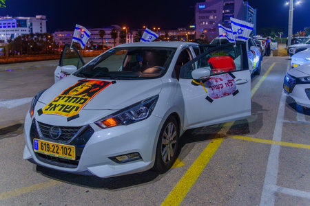 Haifa, Israel - November 11, 2023: Car convoy in a protest against the government, calling for taking responsibility of the war and release of hostages. Haifa, Israelのeditorial素材