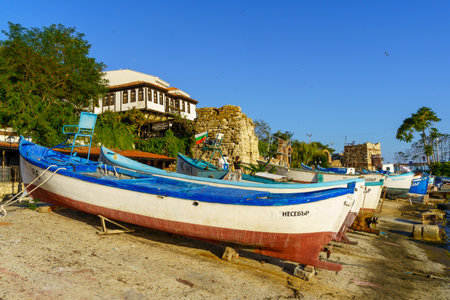 Nesebar, Bulgaria - September 20, 2023: Beach view with various boats and buildings, in the old town of Nesebar, Bulgariaのeditorial素材