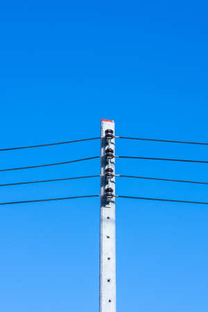 lonely lamp post on blue background.の写真素材