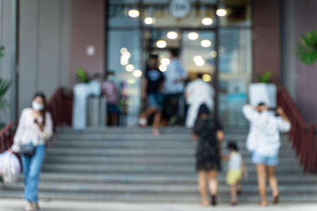 Blurred people walking in to The entrance outdoor of shopping mallの写真素材