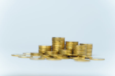Gold coins stack isolated on white backgroundの写真素材