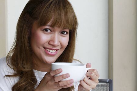 Woman having coffee