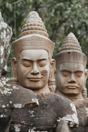 Heads of statues near the busy south gate of Angkor Thom in Siem Reap, Cambodia の写真素材