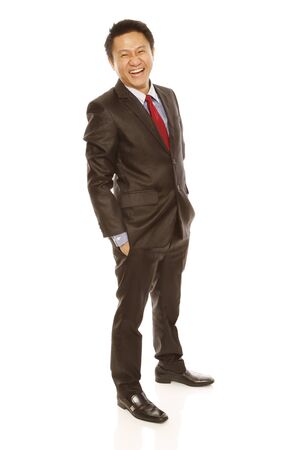 A man in business attire happy and laughing (isolated on white) の写真素材