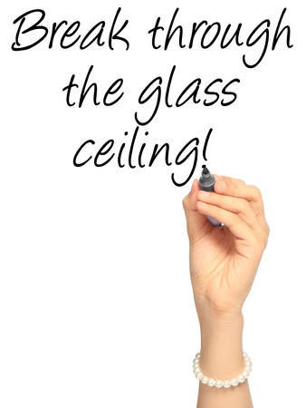 A hand writing an idiom on glass ceilingの写真素材