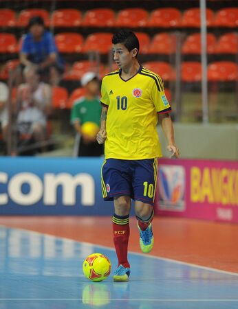 BANGKOK, THAILAND-NOV 18  Angellote Caro of Colombia  y  runs with the ball during the FIFA Futsal World Cup between Italy and Colombia at Indoor Stadium Huamark on Nov18,2012 in Bangkok,Thailand のeditorial素材