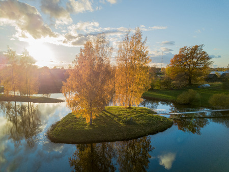 Aerial Photo of an Island in Lake on Sunny Autumn Day with a Droneの写真素材