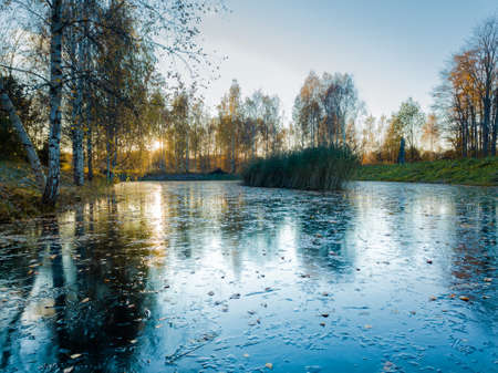 Beautiful Photo of a Frozen Lake in Sunny Autumn Day in an October