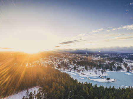Aerial Photography of a Lake Surrounded with Forests in a Sunny Winter Day - vintage look editの写真素材
