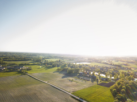 Aerial Drone Photo of a Meadows Surrounded with Beautiful Early Spring Colours in Countryside Villageの写真素材