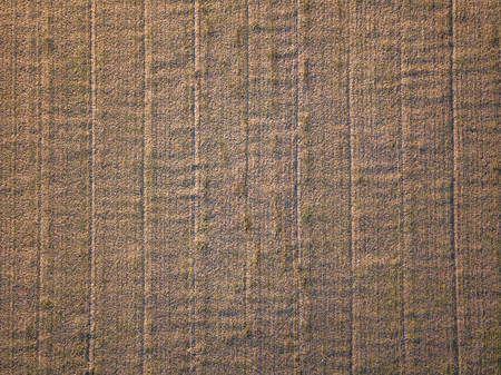 Drone Photo of the Freshly Cultivated Field with Texture in Countryside Village on a Sunny Spring...