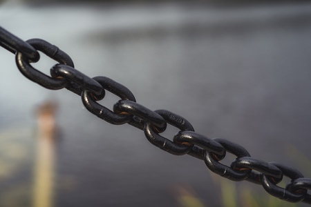 Closeup view of Metal Chain in the Park - Desaturated, Vintage Look with Blurred Background, Autumn dayの写真素材