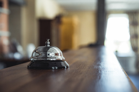 Restaurant Service Bell on the Table in Hotel Reception -  Vintage with Bokeh, Daylight Background - Business Conceptの写真素材