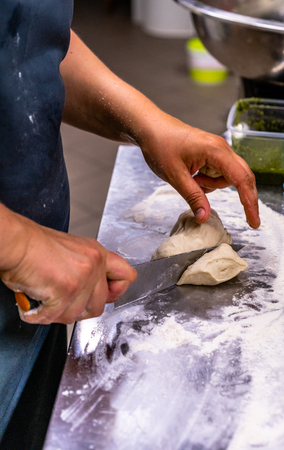 Female Chef Preparing Bread Dough for Selfmade Bread and Pattiesの写真素材