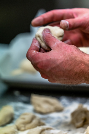 Male Chef Preparing Bread Dough for Selfmade Bread and Pattiesの写真素材