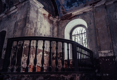 Inside Interior of an old Abandoned Church in Latvia, Galgauska - light Shining Through the Windows, Post Apocalyptic, Desaturated Vintage Lookの写真素材