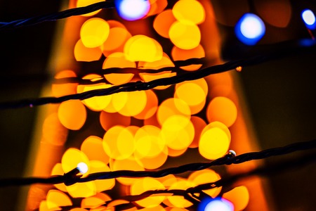 Blurred colorful Christmas Lights and New year Decoration Background - Yellow Colorの写真素材