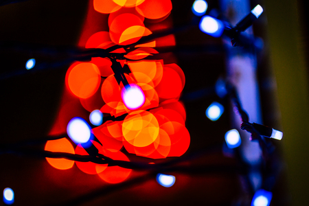 Blurred colorful Christmas Lights and New year Decoration Background - Red Colorの写真素材