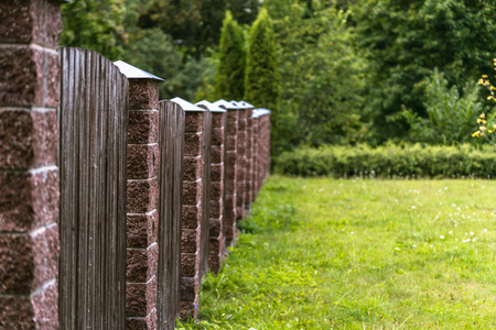 Colorful Photo of the Brick and Wooden Fence in the Park - Sunny Autumn Dayの写真素材