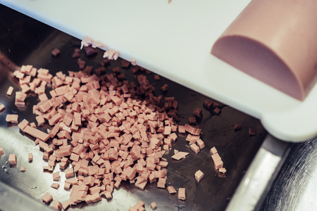 Small Cutted Ham Pieces in Steel Bowl - Closeup View, Vintage Film Lookの写真素材