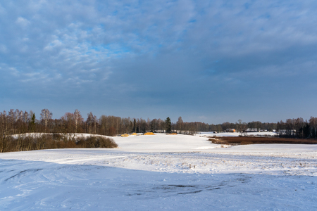 Empty Countryside Landscape in Sunny Winter Day with Snow Covering the Ground, Abstract Background - Concept of Fun and Joyの写真素材