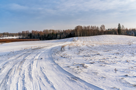 Empty Countryside Landscape in Sunny Winter Day with Snow Covering the Ground, Abstract Background - Concept of Fun and Joyの写真素材