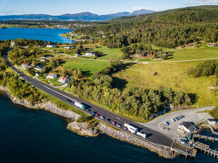 Drone Photo of the Cars Waiting in Line on Ferry Port in Langfjorden in Norway on a Sunny Summer Day...