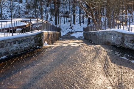 Photo of an Water Flowing in Park on Sunny Winter Day - Concept of Joy and Harmonyの写真素材