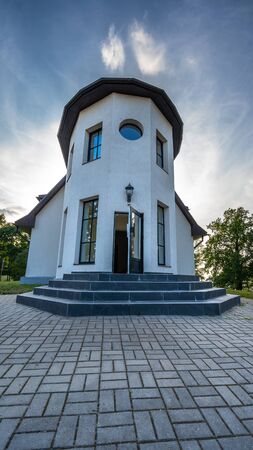 Daugmale / Latvia - September 21th, 2018: Photo of the Guesthouse "Upesvilla" on the Bank of River Daugava on Sunny Autumn Day with Dramatic Sky Behind itのeditorial素材