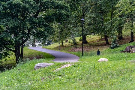 Colorful Photo of the Park on a Sunny Autumn day - Walking Path in the Middle of it, Concept of the Harmony and Travel in the Countrysideの写真素材