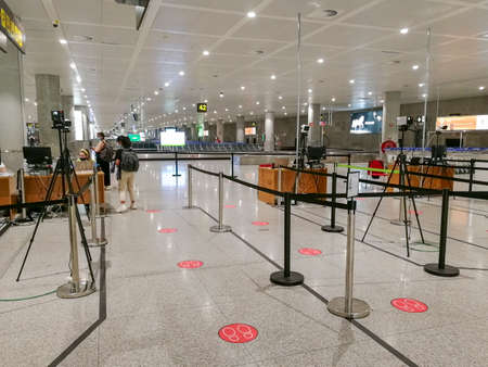Malaga / Spain - August 15th, 2020 Passengers boarding plane, wearing face masks, ryanair