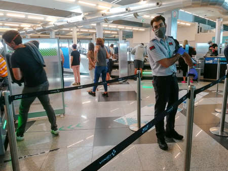 Malaga / Spain - August 15th, 2020 Passengers boarding plane, wearing face masks, ryanairのeditorial素材
