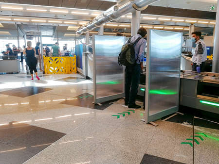 Malaga / Spain - August 15th, 2020 Passengers boarding plane, wearing face masks, ryanair