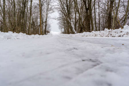 Winter Scene on Countryside Road Covered with Snow - Low angle photo