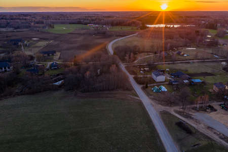 Rural Countryside Farmland Fields in Sunset, Drone Photo in Warm Summer Eveningの写真素材