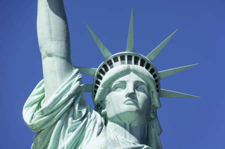 Statue of Liberty in New York set against a clear blue skyの写真素材