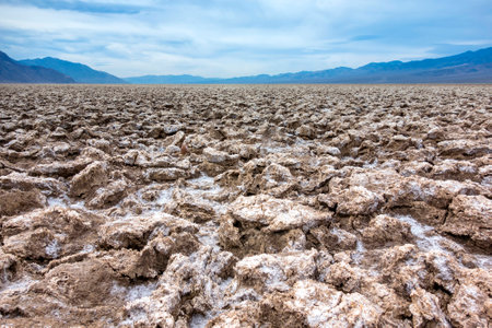 The rough ground and salt crystals which form the unusual geology of the Devilの写真素材