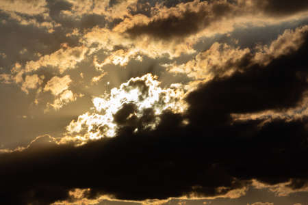 Cumulus clouds in the sky with a sunset.
