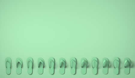 Flip flops on pastel green background. Summer concept.の写真素材